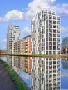 New apartment buildings reflected in a canal, Turnhout, Belgium.
