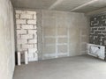 New apartment, new building without finishing and repair, with free planning and walls made of concrete, bricks and gas silicate Royalty Free Stock Photo