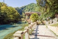 Stone trail along the lake towards the Psirtskha Railway Station on sunny summer day Royalty Free Stock Photo