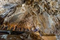 People tourists in Abkhazia in big undrground cave Royalty Free Stock Photo