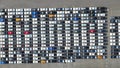 New automobiles background which lined up in the port for import and export business logistic to dealership for sale,Abovel view Royalty Free Stock Photo