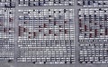 New automobiles background which lined up in the port for import and export business logistic to dealership for sale,Aerial view Royalty Free Stock Photo