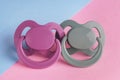 New baby pacifiers on color background, closeup