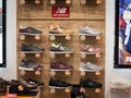 New Balance logo and sneakers on display in the window of their main retailer in Belgrade. New Balance is a sneakers producer