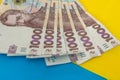 1000 new banknote of Ukraine on yellow blue background. Save and money cocncept Royalty Free Stock Photo