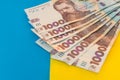 1000 new banknote of Ukraine on yellow blue background. Save and money cocncept Royalty Free Stock Photo