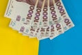 1000 new banknote of Ukraine on yellow blue background. Save and money cocncept Royalty Free Stock Photo