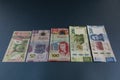 New banknotes of 20,50,100,200,500 Mexican pesos arranged on a blue background