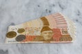 New banknotes of Pakistan 5000 rupees with coins with selective focus Royalty Free Stock Photo