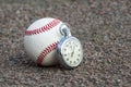 New baseball with an old sport stopwatch Royalty Free Stock Photo