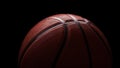 New basketball ball rubber orange on a dark dramatic light background