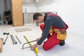 New Bathroom Interior Finishing. Caucasian Men in His 30s Assembling Modern Cabinets. Home Interior Remodeling Theme. Royalty Free Stock Photo