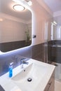 Bathroom interior with illuminated mirror Royalty Free Stock Photo