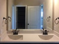 New bathroom with two sinks and mirror on the wall Royalty Free Stock Photo