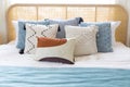 New bed comfort with decorative pillows ,headboard and side table lamp. Royalty Free Stock Photo
