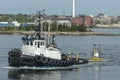 Tug towing Lidar buoy out of New Bedford harbor