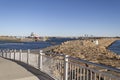 Blue Lane pedestrian path in New Bedford  overlooking hurricane barrier and survey vessels in port Royalty Free Stock Photo