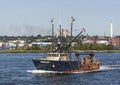 Commercial fishing vessel Tropico passing New Bedford waterfront Royalty Free Stock Photo