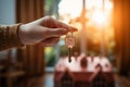 New beginning woman holds key house keychain in a fresh space