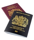 A new black British non European passport on a white background Royalty Free Stock Photo