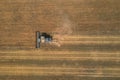 New Black Harvester on the wheat field from the top view. Harvest time. Royalty Free Stock Photo