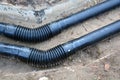 New black heating water tube pipe in trench