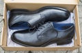 New black leather shoes in a paper box Royalty Free Stock Photo