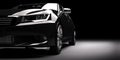 New black metallic sedan car in spotlight. Modern desing, brandless. Royalty Free Stock Photo