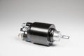 New black solenoid for a starter for a car on a gray gradient background. Auto parts. Starter Parts Royalty Free Stock Photo