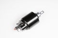 New black solenoid for a starter for a car on a gray gradient background. Auto parts. Starter Parts Royalty Free Stock Photo