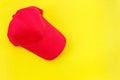 New blank red baseball hat on yellow background with free space Royalty Free Stock Photo