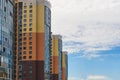 New block of modern apartments with balconies and blue sky in the background Royalty Free Stock Photo