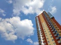 New block of modern apartments with balconies and blue sky in the background Royalty Free Stock Photo