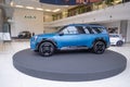 new blue electric Kia EV9 GT-Line AWD, South Korean ev 2024 in showroom, trends in use EV in contemporary Europe, technological