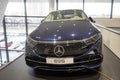 new blue electric Mercedes EQS 580 4MATIC car in showroom, EV contemporary, technological advancements in automotive industry,