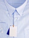 New blue shirt with blank label Royalty Free Stock Photo