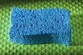 New blue sponge on dishcloth Royalty Free Stock Photo