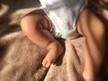 New Born Baby Feet on brown blanket Royalty Free Stock Photo