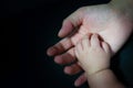 New born baby hand in mother's palm Royalty Free Stock Photo