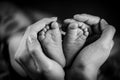 New born baby`s feet in mother hands - hearth shape Royalty Free Stock Photo