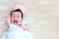 New born baby sleep on the basket or on the bed and keep smile with everyone. Feeling love the new born baby and need to take care Royalty Free Stock Photo