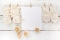 New Born or baptism Greeting Card. Blank with baby girl shoes and gloves on white wooden background