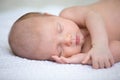 New born child sleeping on white blanket Royalty Free Stock Photo