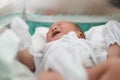 new born infant asleep in the blanket in delivery room Royalty Free Stock Photo