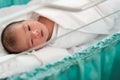 new born infant asleep in the blanket in delivery room Royalty Free Stock Photo