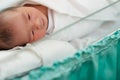 new born infant asleep in the blanket in delivery room Royalty Free Stock Photo