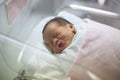 New born infant asleep in the blanket in delivery room Royalty Free Stock Photo