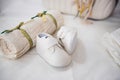 New born white baptism shoes and towel