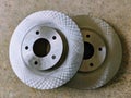 New brake rotors for cars on a garage floor Royalty Free Stock Photo