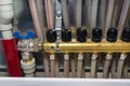New brass manifold for underfloor heating with manual knobs to open the manifold valves.